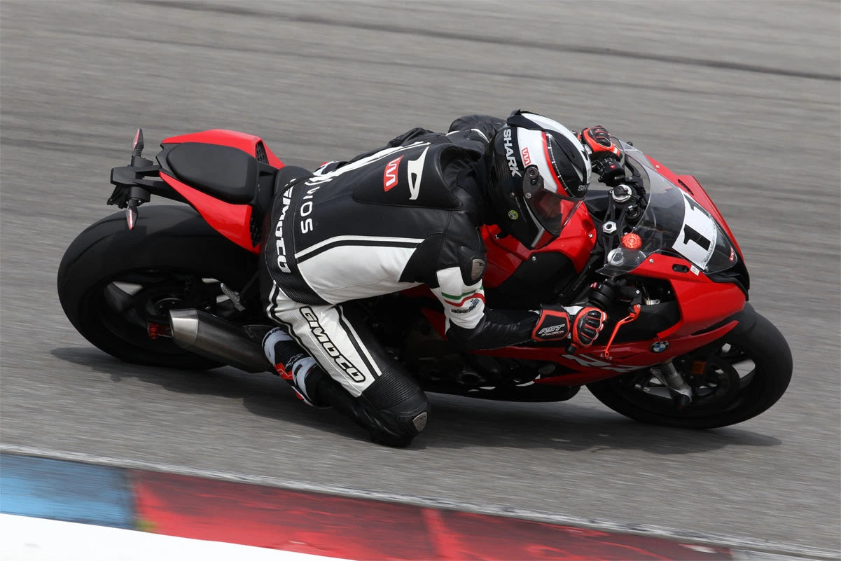 A Womet-Tech sponsored motorcycle rider pictured on the race track